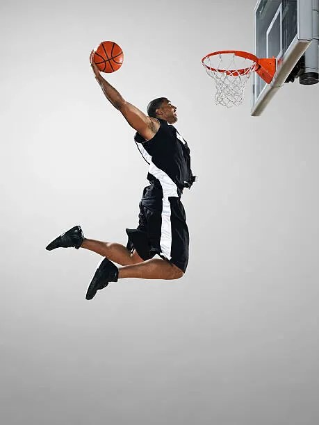 Foto Basketball player dunking ball, low angle view, Blake Little