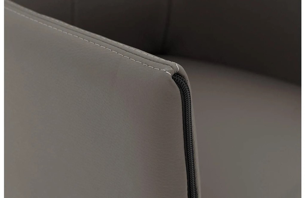 Goossens Eetkamerstoel Funk RVS Poten grijs leer met armleuning en Transparant skater wiel met rvs kapmet wielen, modern design