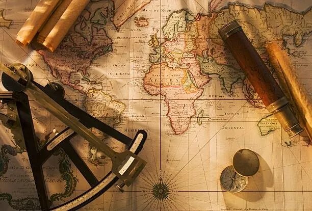 Foto Octant, compass and telescope on nautical map, Tetra Images