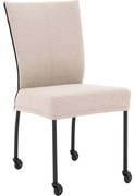 Goossens Eetkamerstoel Funk Zwarte Poten beige stof leuning en Zwart skater wiel met zwarte kapmet wielen, modern design