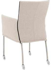 Goossens Eetkamerstoel Funk RVS Poten beige stof met armleuning en met wielenTransparant skater wiel met rvs kap, modern design