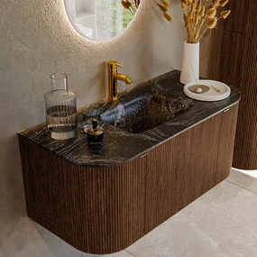 Mondiaz Kurve-dlux 100cm badmeubel ronding links/rechts walnut met 1 lade en 2 deuren en wastafel grunne midden 1 kraangat lava