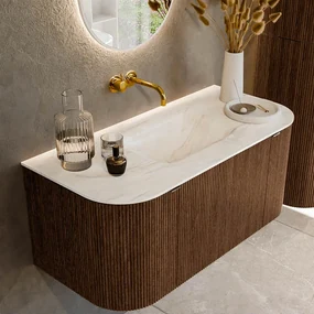 Mondiaz Kurve-dlux 100cm badmeubel ronding links/rechts walnut met 1 lade en 2 deuren en wastafel grunne midden zonder kraangat ostra