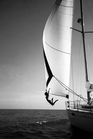 Foto Woman jumping from a yacht into the ocean., Mint Images