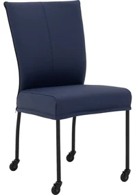 Goossens Eetkamerstoel Funk Zwarte Poten blauw leer leuning en met wielenZwart skater wiel met zwarte kap, modern design
