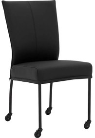 Goossens Eetkamerstoel Funk Zwarte Poten zwart leer leuning en Zwart skater wiel met zwarte kapmet wielen, modern design