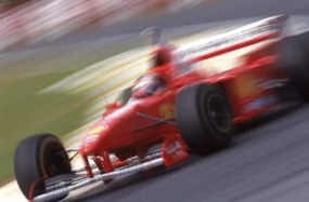 Foto Michael Schumacher in a Ferrari F310B at the Brazilian GP, Sao Paulo, Brazil, 1997, (40 x 26.7 cm)
