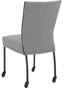 Goossens Eetkamerstoel Funk Zwarte Poten grijs stof leuning en met wielenZwart skater wiel met zwarte kap, modern design