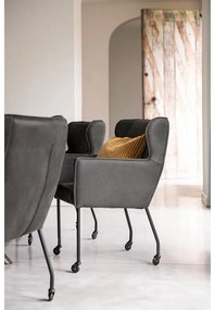 Goossens Excellent Eetkamerstoel Leogang zwart leer met armleuning en met wielen, elegant chic