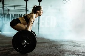 Foto Side view of athletic woman exercising, skynesher
