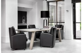 Goossens Excellent Eetkamerstoel Lini zwart leer  met armleuning en met wielenmet chromen wielen, modern design