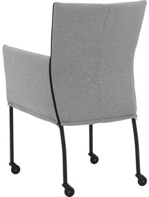 Goossens Eetkamerstoel Funk Zwarte Poten grijs stof met armleuning en met wielenZwart skater wiel met zwarte kap, modern design